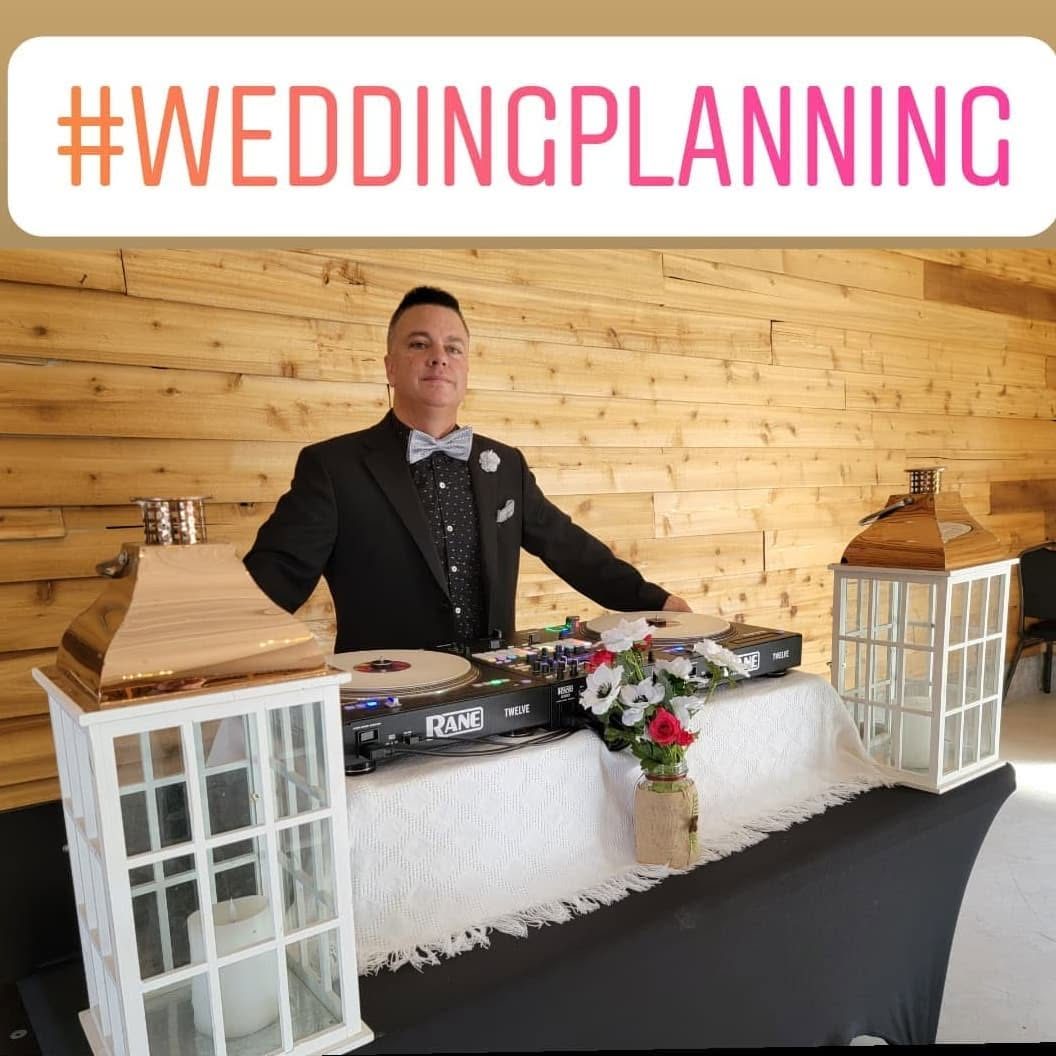 DJ Sugar's setup with white lantern décor