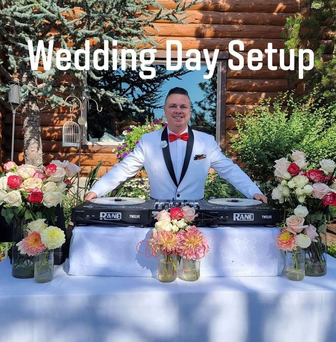 DJ Sugar's elegant wedding day turntable setup with florals